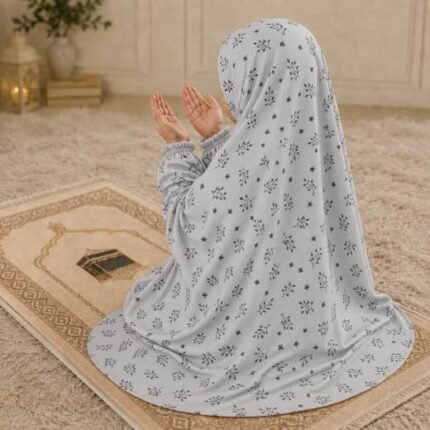 Young girl wearing a soft, breathable kids namaz chadar with comfortable sleeves, ideal for children offering namaz. BY CLOTHIFYDOTPK