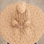 Young girl wearing a soft, breathable kids namaz chadar with comfortable sleeves, ideal for children offering namaz. BY CLOTHIFYDOTPK