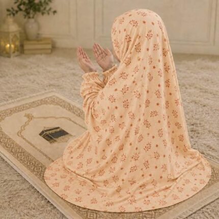 Young girl wearing a soft, breathable kids namaz chadar with comfortable sleeves, ideal for children offering namaz. BY CLOTHIFYDOTPK