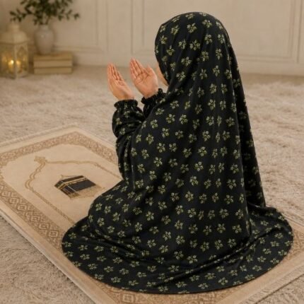 A young girl wearing a soft, lightweight kids namaz chadar with sleeves made of breathable fabric, sized perfectly for a child offering salah. BY CLOTHIFYDOTPK
