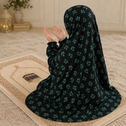 A young girl wearing a soft, lightweight kids namaz chadar with sleeves made of breathable fabric, sized perfectly for a child offering salah. BY CLOTHIFYDOTPK