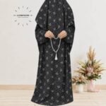 Woman standing wearing printed arabic namaz chadar holding prayer beads full coverage and comfort without compromising style. BY CLOTHIFYDOTPK