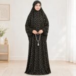 Woman standing wearing printed arabic namaz chadar holding prayer beads full coverage and comfort without compromising style. BY CLOTHIFYDOTPK