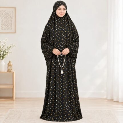 Woman standing wearing printed arabic namaz chadar holding prayer beads full coverage and comfort without compromising style. BY CLOTHIFYDOTPK