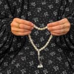 Woman wearing printed arabic namaz chadar holding prayer beads full coverage and comfort without compromising style. BY CLOTHIFYDOTPK