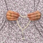 Woman wearing printed arabic namaz chadar holding prayer beads full coverage and comfort without compromising style. BY CLOTHIFYDOTPK