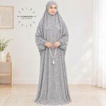 Woman standing wearing printed arabic namaz chadar holding prayer beads full coverage and comfort without compromising style. BY CLOTHIFYDOTPK