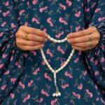 Woman wearing printed arabic namaz chadar holding prayer beads full coverage and comfort without compromising style. BY CLOTHIFYDOTPK