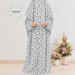 Woman standing wearing printed arabic namaz chadar holding prayer beads full coverage and comfort without compromising style. BY CLOTHIFYDOTPK