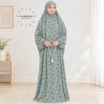 Woman standing wearing printed arabic namaz chadar holding prayer beads full coverage and comfort without compromising style. BY CLOTHIFYDOTPK