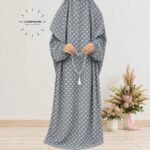 Woman standing wearing printed arabic namaz chadar holding prayer beads full coverage and comfort without compromising style. BY CLOTHIFYDOTPK