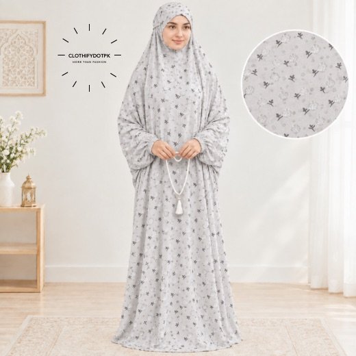Arabic Namaz chadar - 38 Woman standing wearing printed arabic namaz chadar holding prayer beads full coverage and comfort without compromising style. BY CLOTHIFYDOTPK