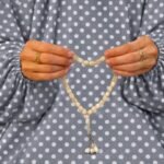 Woman wearing printed arabic namaz chadar holding prayer beads full coverage and comfort without compromising style. BY CLOTHIFYDOTPK