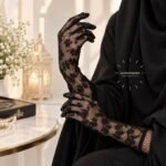 Women wearing a pair of fancy, imported net gloves featuring a detailed mesh pattern. BY CLOTHIFYDOTPK