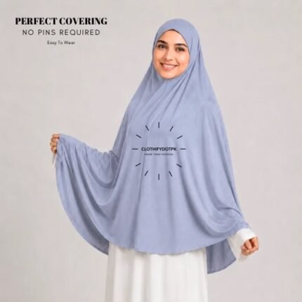 A woman wearing a Frost Blue jersey Hajj and Umrah scarf – a Namaz Makhna hijab designed for head, neck and shoulder coverage without the need for pins. By CLOTHIFYDOTPK