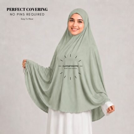 A woman wearing a Urban Sage jersey Hajj and Umrah scarf – a Namaz Makhna hijab designed for head, neck and shoulder coverage without the need for pins. By CLOTHIFYDOTPK