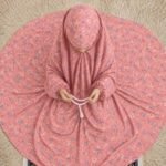 A young girl wearing a soft, lightweight kids namaz chadar with sleeves made of breathable fabric, sized perfectly for a child offering salah. BY CLOTHIFYDOTPK