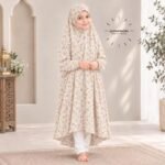 A young girl wearing a soft, lightweight kids namaz chadar with sleeves made of breathable fabric, sized perfectly for a child offering salah. BY CLOTHIFYDOTPK