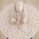 A young girl wearing a soft, lightweight kids namaz chadar with sleeves made of breathable fabric, sized perfectly for a child offering salah. BY CLOTHIFYDOTPK
