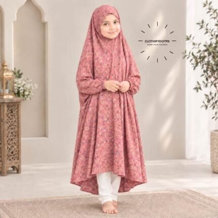 A young girl wearing a soft, lightweight kids namaz chadar with sleeves made of breathable fabric, sized perfectly for a child offering salah. BY CLOTHIFYDOTPK
