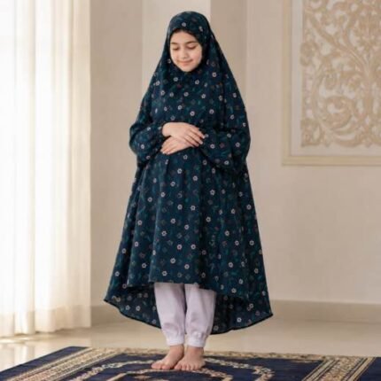 A kid wearing breathable soft swiss lawn modest coverage Namaz Chadar with sleeves, performing salah. By Clothifydotpk