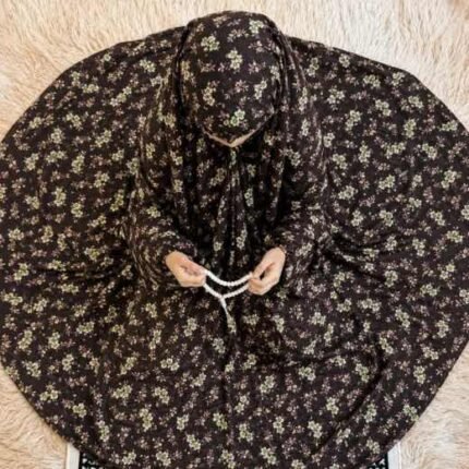 Young girl wearing a soft, breathable kids namaz chadar with comfortable sleeves, ideal for children offering namaz. BY CLOTHIFYDOTPK