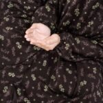 Young girl wearing a soft, breathable kids namaz chadar with comfortable sleeves, ideal for children offering namaz. BY CLOTHIFYDOTPK