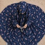 Young girl wearing a soft, breathable kids namaz chadar with comfortable sleeves, ideal for children offering namaz. BY CLOTHIFYDOTPK
