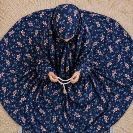 Young girl wearing a soft, breathable kids namaz chadar with comfortable sleeves, ideal for children offering namaz. BY CLOTHIFYDOTPK