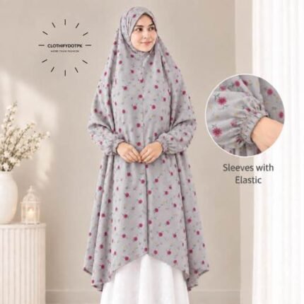 A woman standing for Salah comfortably in a breathable, soft Swiss lawn Namaz Chadar with sleeves- available at CLOTHIFYDOTPK