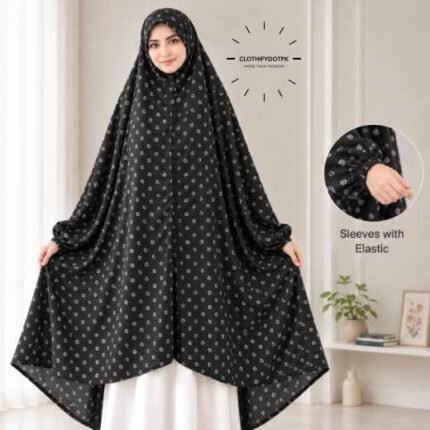 A woman standing for Salah comfortably in a breathable, soft Swiss lawn Namaz Chadar with sleeves- available at CLOTHIFYDOTPK
