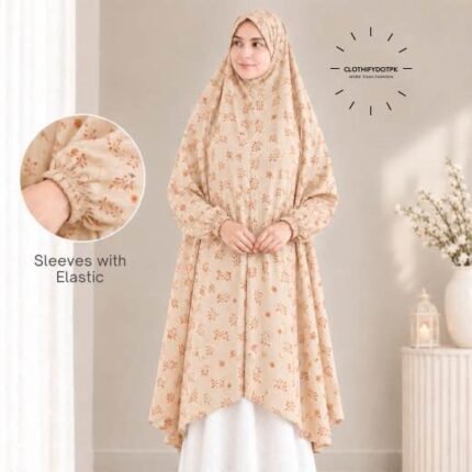 A woman standing for Salah comfortably in a breathable, soft Swiss lawn Namaz Chadar with sleeves- available at CLOTHIFYDOTPK