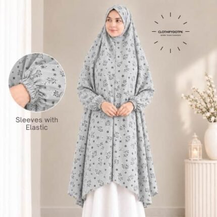 A woman standing for Salah comfortably in a breathable, soft Swiss lawn Namaz Chadar with sleeves- available at CLOTHIFYDOTPK