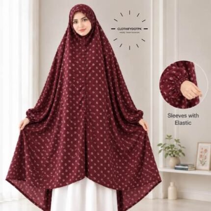 A woman standing for Salah comfortably in a breathable, soft Swiss lawn Namaz Chadar with sleeves- available at CLOTHIFYDOTPK