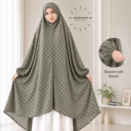 A woman standing for Salah comfortably in a breathable, soft Swiss lawn Namaz Chadar with sleeves- available at CLOTHIFYDOTPK