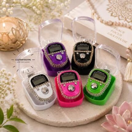 A medium, handheld digital embellished LED tally counter used for tasbeeh, with a simple display showing the current count and a button on top to increment it. BY CLOTHIFYDOTPK