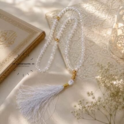 A beautiful tasbeeh made of shimmering clear crystal beads, strung together with a decorative tassel at the end. BY CLOTHIFYDOTPK