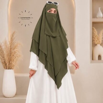A woman wearing a three layer khimar, with the first layer covering her head and draping down over her chest, and two additional sheer or lightweight layers cascading underneath. BY CLOTHIFYDOTPK