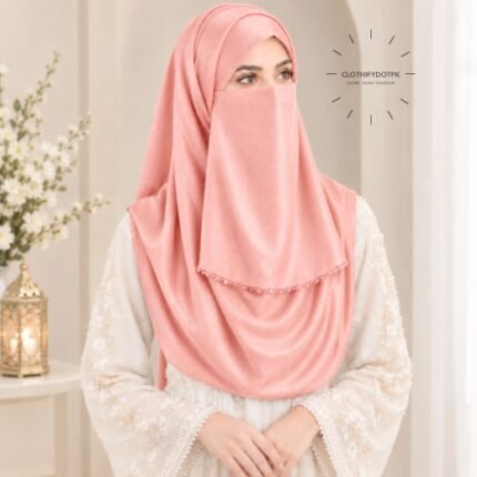 Woman wearing soft peach color crinkle silk hijab with crystal embellished niqab set with beautiful drape and full coverage. BY CLOTHIFYDOTPK