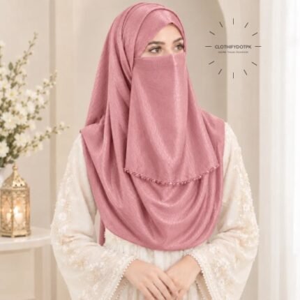 Woman wearing blush color soft crinkle silk hijab with crystal embellished niqab set with beautiful drape and full coverage. BY CLOTHIFYDOTPK
