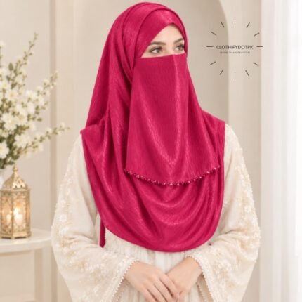 Woman wearing hot pink color soft crinkle silk hijab with crystal embellished niqab set with beautiful drape and full coverage. BY CLOTHIFYDOTPK