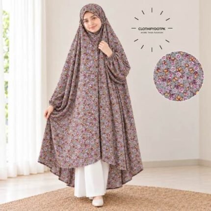 A girl wearing breathable soft swiss lawn modest coverage Kids Namaz Chadar with sleeves. BY CLOTHIFYDOTPK