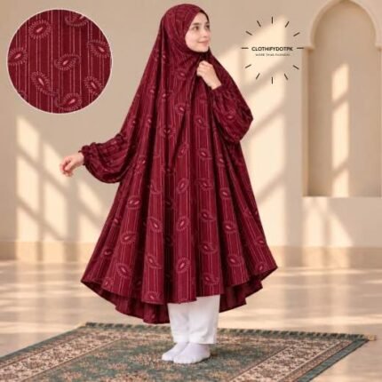 A young girl wearing a soft, Kids Winter Namaz Chadar with sleeves made of breathable warm fabric, sized perfectly for a child | BY CLOTHIFYDOTPK