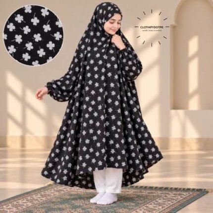 A young girl wearing a soft, Kids Winter Namaz Chadar with sleeves made of breathable warm fabric, sized perfectly for a child | BY CLOTHIFYDOTPK