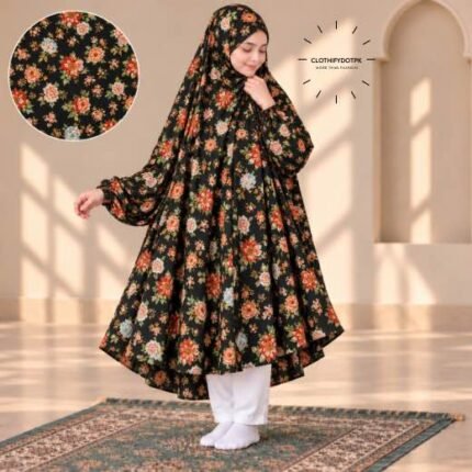 A young girl wearing a soft, Kids Winter Namaz Chadar with sleeves made of breathable warm fabric, sized perfectly for a child | BY CLOTHIFYDOTPK