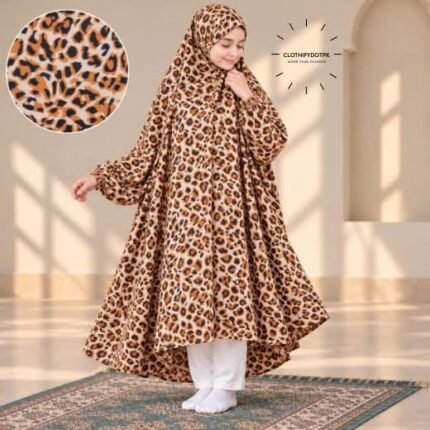 A young girl wearing a soft, Kids Winter Namaz Chadar with sleeves made of breathable warm fabric, sized perfectly for a child | BY CLOTHIFYDOTPK