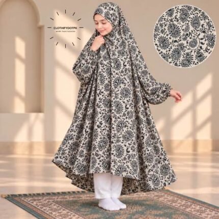 A young girl wearing a soft, Kids Winter Namaz Chadar with sleeves made of breathable warm fabric, sized perfectly for a child | BY CLOTHIFYDOTPK