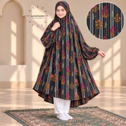 A young girl wearing a soft, Kids Winter Namaz Chadar with sleeves made of breathable warm fabric, sized perfectly for a child | BY CLOTHIFYDOTPK